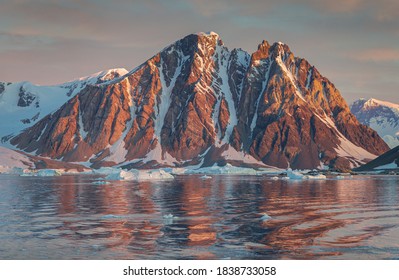 Ice Bergs At Sunset In Antartica