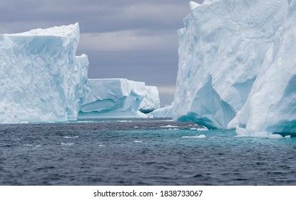 Ice Bergs At Sunset In Antartica