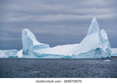 Ice Bergs At Sunset In Antartica