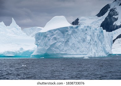 Ice Bergs At Sunset In Antartica