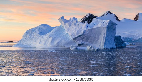 Ice Bergs At Sunset In Antartica