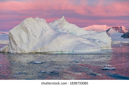 Ice Bergs At Sunset In Antartica