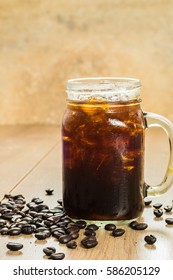 Ice Black Coffee In Jug, Jar, Mug Glass Cups On The Table