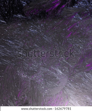 ice block structure with frost pattern, illuminated with violet effect light