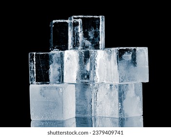 Ice blocks in a cube form, stacked on a reflective surface on a black background.