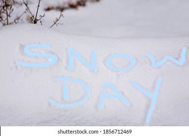 Ice Blue SNOW DAY Letters Fingerpainted Into Fresh Snow Announce No School Or School Closed Or No Business Due To Dangerous Weather Conditions