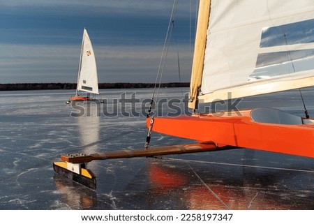 Ice boats on ice with sails