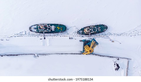 Ice Bound Ships Froze In Snow In Winter, Waiting For Breaker, Aerial Top View.