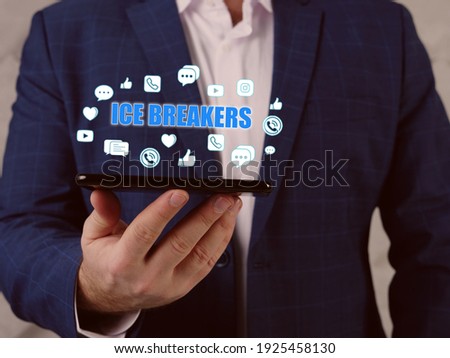  ICE BREAKERS text in search bar. Merchant looking at cellphone. The person that shows you around when you're new to a community