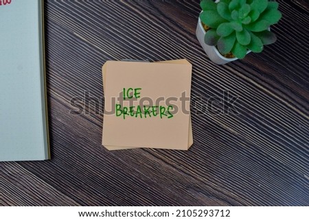 Ice Breakers write on sticky notes isolated on Wooden Table.
