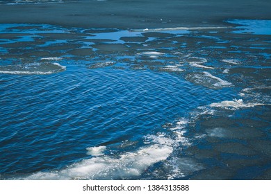 Ice Breaking Off A Lake