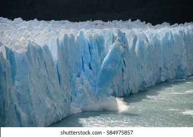 Ice Calving: A giant chunk of ice breaking off the magnificent Perito Moreno Glacier in Patagonia, Argentina. 