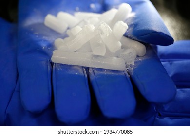 Ice Of Carbon Dioxide (dry Ice) On Top Of Thermal Protective Gloves