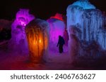 The Ice Castle in Cripple Creek Colorado. Tons of ice and colored lights in the ice castle. There are adult and children