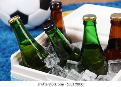 Ice Chest Full Of Drinks In Bottles On Color Carpet Background