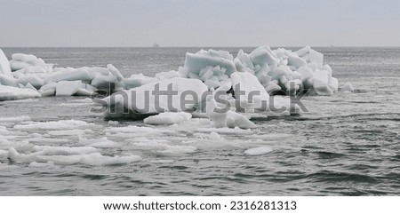 Ice Climatic collapse, heaps of ice blocks on the piers and the shore. The Black Sea near Odessa is frozen