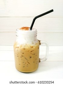 Ice Coffee Capucino In The Jar On White Wooden Background