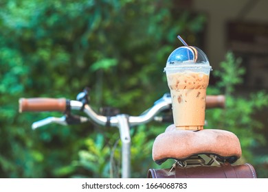 Ice Coffee To Go  On Table In Garden.