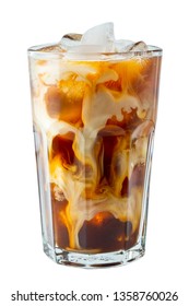 Ice coffee in a tall glass with cream poured over and coffee beans. Cold summer drink on a light background.