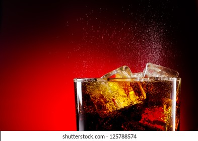 Ice Cola With Splashing CO Bubbles