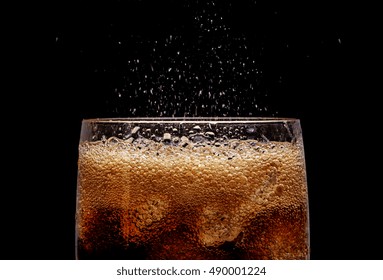 Ice Cola With Splashing CO Bubbles. Drink With Ice, Closeup, Fizzing, Fizz.