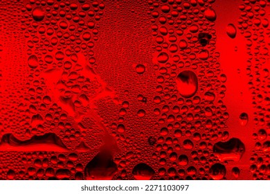 Ice cold glass fresh coca cola covered with water drops condensation Cold drink Drops of water cola drink background Raindrops texture Close up