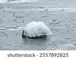 Ice covered rocks along lakeshore at Colonel Samuel Smith Park during Winter