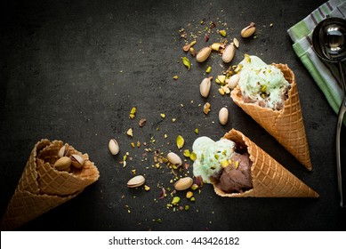 Ice Cream With Chocolate And Pistachios On A Dark Slate Background.