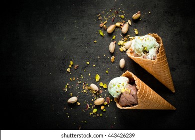 Ice Cream With Chocolate And Pistachios On A Dark Slate Background.