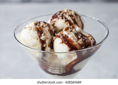 Ice Cream With Chocolate Syrup In An Ice-cream Bowl, Selective Focus