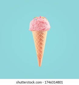 Ice cream cone close-up. Pink Icecream scoop in waffle cone over blue background. Strawberry or raspberry flavor Sweet dessert decorated with colorful sprinkles, closeup