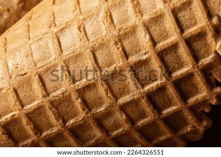 Ice cream cone close-up, waffle cone texture.