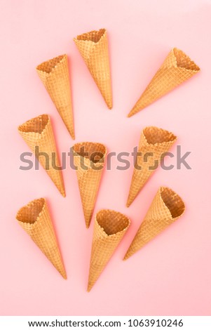 Similar – Ice cream cone with unpeeled peanuts on pink background