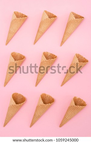 Similar – Ice cream cone with unpeeled peanuts on pink background