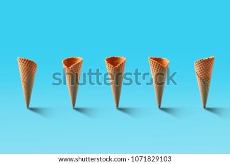 Ice cream cones pattern. Turquoise background. Sweet, summer and empty concept.