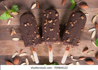 Ice Cream Covered Bar With Chocolate And Almonds Sticks. Top View.