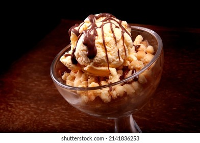 Ice Cream Cup Dessert With Apple Pie And Chocolate Sauce Close-up On Wooden Table 