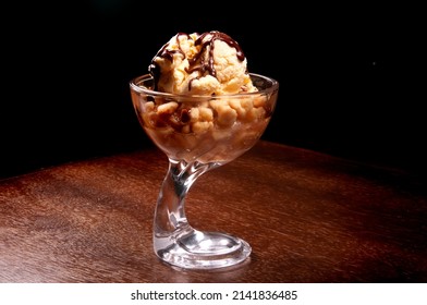 Ice Cream Cup Dessert With Apple Pie And Chocolate Sauce On Wooden Table
