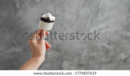 Ice cream in a female hand. Sweet dessert