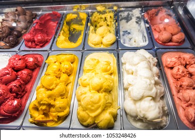 Ice Cream Frozen Yogurt Yellow Red Colorful Serving Counter Parlour With Many Scoopable Flavors, Sorbet, Chocolate, Toppings