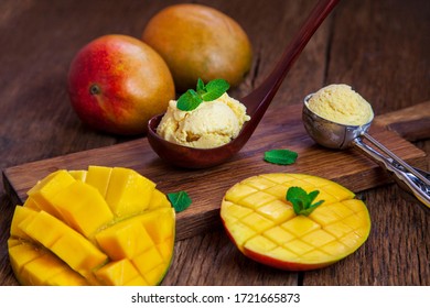 Ice Cream With Mango Pulp, Garnished With Mint, On Wooden Background