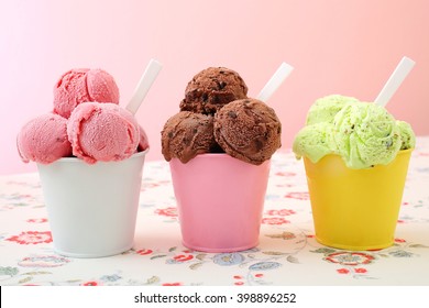 ice cream in metal cup on kitchen table background