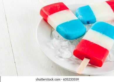 ICe Cream. Patriotic Red White Blue Popsicles For 4th Of July Holiday, On White Wooden Table. Copy Space