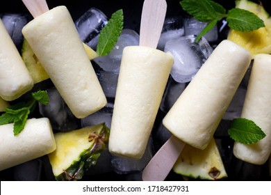 Ice cream popsicles made with pineapple and yogurt. Summer refreshment. Homemade healthy dessert. Recipe ideas. Close up. - Powered by Shutterstock