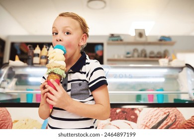 Ice cream, portrait and kid in store for dessert, craving or sweet treat on summer vacation. Happy, cute and boy child eating scoop of frozen gelato in cone at dairy shop on holiday or weekend trip. - Powered by Shutterstock