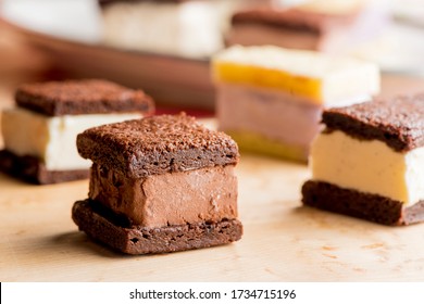 Ice cream sandwiches. Chocolate chip Cookie crusts filled with homemade vanilla and chocolate ice cream. Classic American dessert favorite.