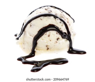 ice cream: A scoop of stracciatella ice cream topped with chocolate sauce