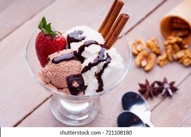 Ice Cream Sundae, Waffle Cone, Spoons, Walnuts And Strawberry 