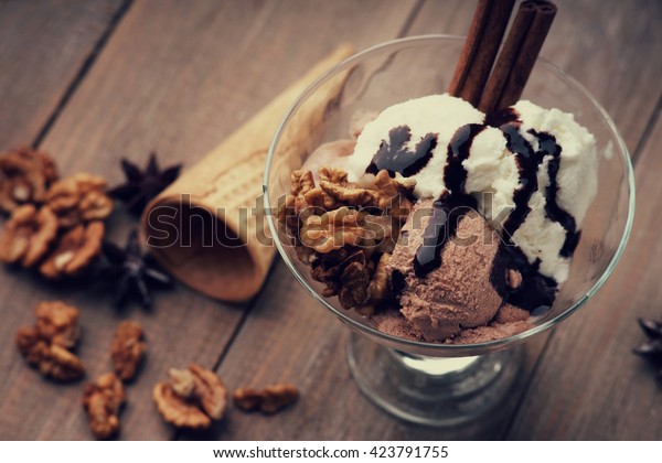 Ice cream sundae,\
waffle cone and walnuts