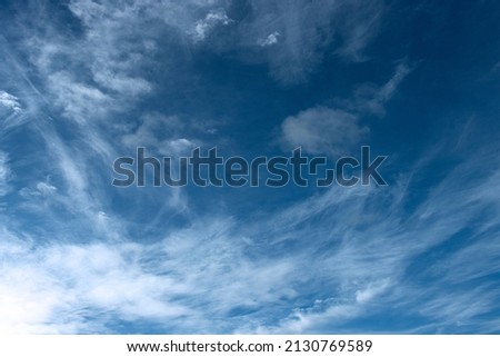 Ice crystals form in thin layers in the upper atmosphere and form wispy tendrils  of Cirrus clouds. These can develop into cirro-stratus, a blanket form that covers vast areas